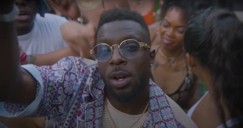 Isaiah Rashad throws a day party in the video for his new single "Wat U Sed"